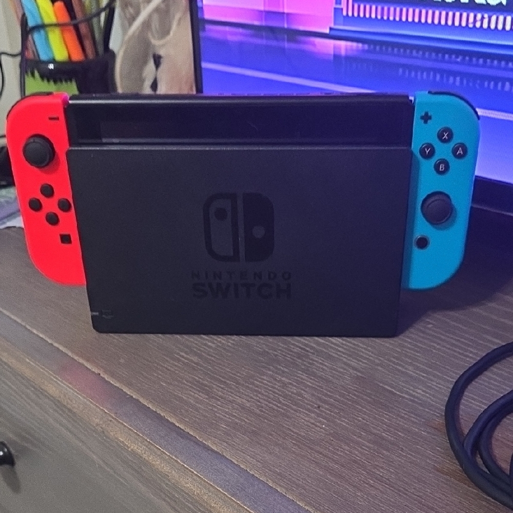 Nintendo Console with Vibrant Red and Blue Controllers